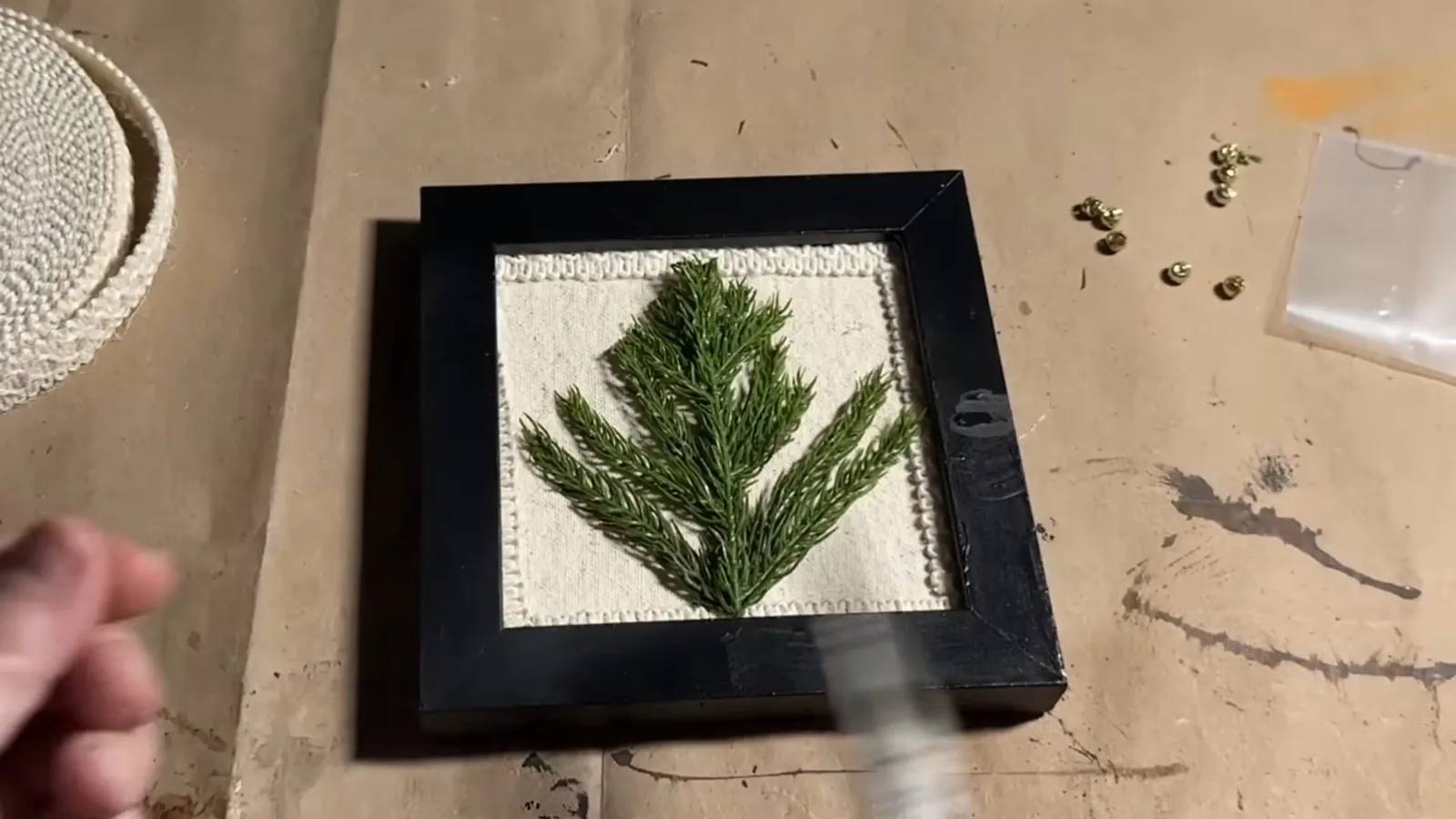 Making a dimensional evergreen tree decoration inside a fabric-lined picture frame